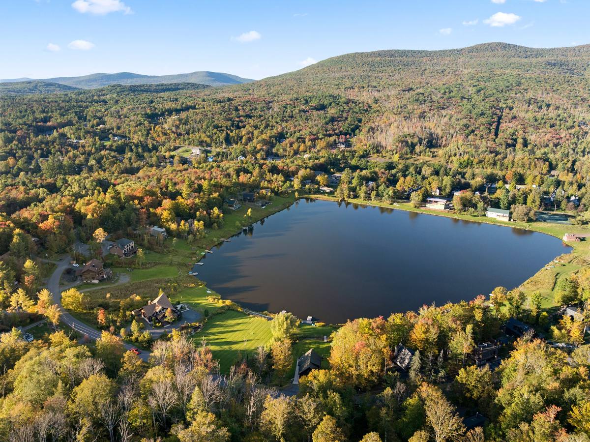 Aerial view of the lake and surrounding Catskill hills in autumn