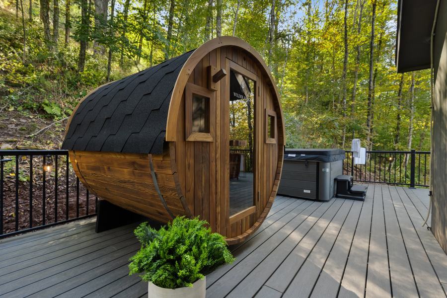 Redwood barrel sauna and hot tub on the deck among the trees